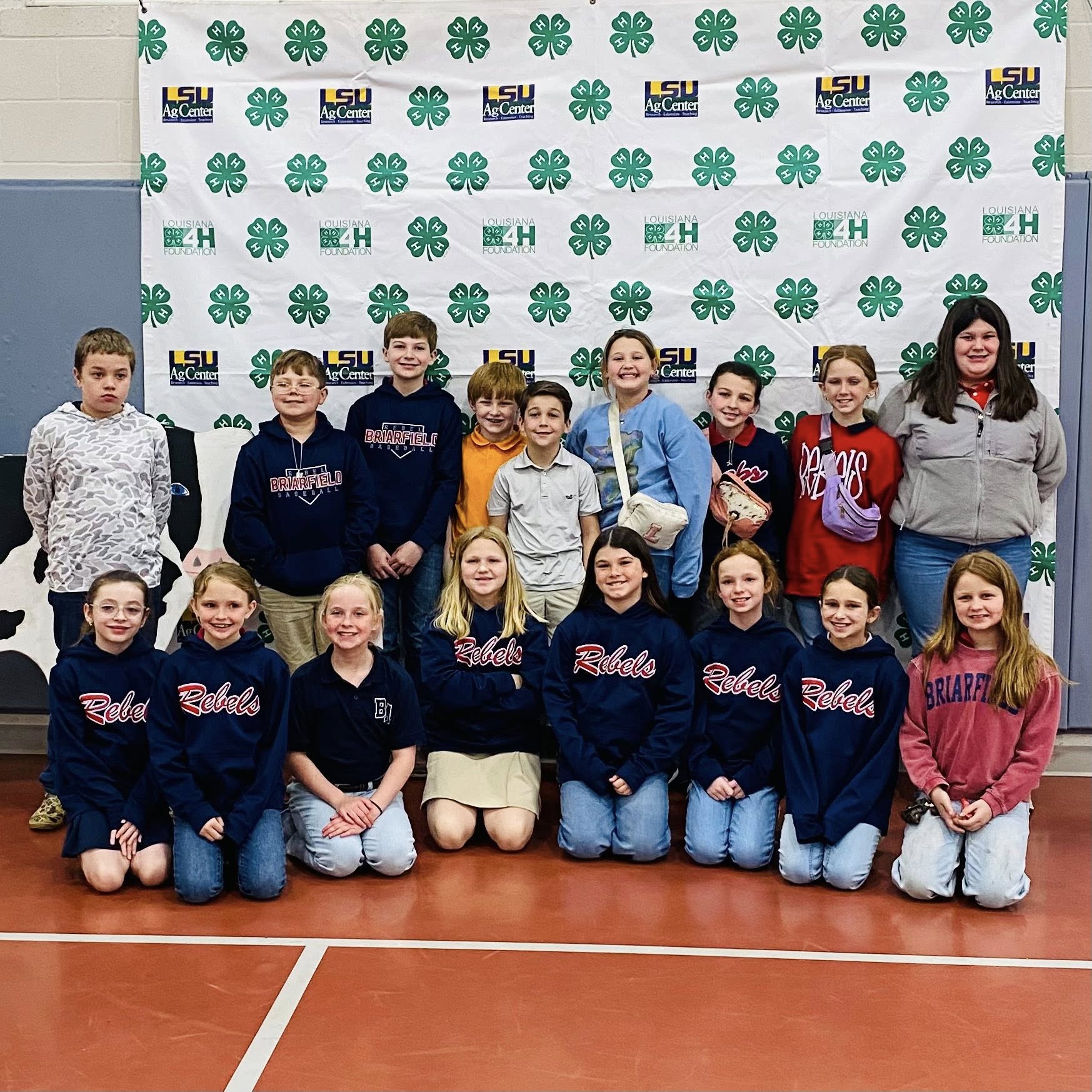 A group of kids posing for a photo.